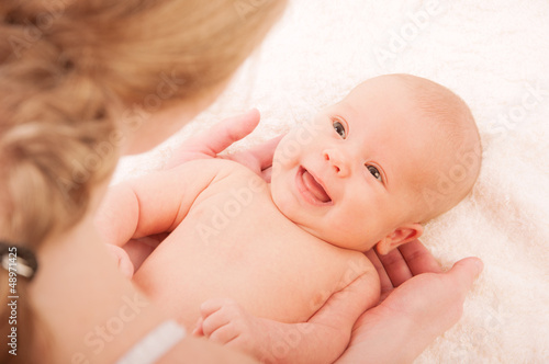 Photo: newborn baby in the arms of mother newborn baby in the arms of mother