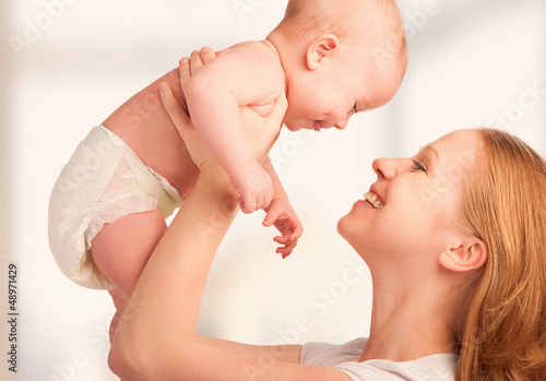 Photo: Happy family. young mother and baby Happy family. young mother and baby