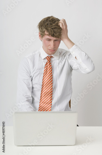 Photo: Frustrated Man Working On Laptop Frustrated Man Working On Laptop