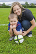 Young Boy Holding A Soccer Ball