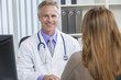 Foto: Male Hospital Doctor Talking to Female Patient Male Hospital Doctor Talking to Female Patient