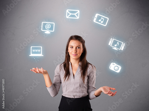 Photo: pretty girl juggling with elecrtonic devices icons pretty girl juggling with elecrtonic devices icons