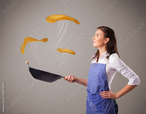 Photo: Woman making pancakes Woman making pancakes