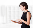 Young woman looking at modern tablet