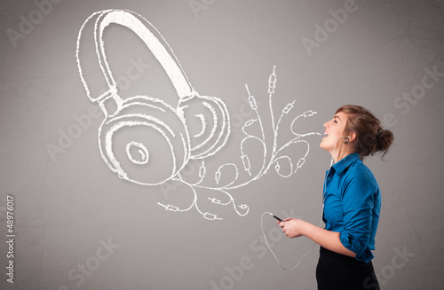 Photo: young woman singing and listening to music with abstract headpho young woman singing and listening to music with abstract headpho