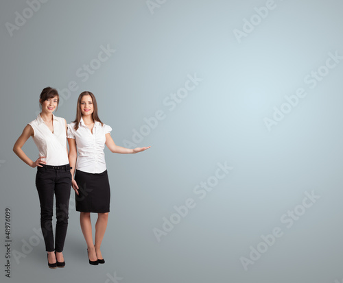 Photo: Pretty woman presenting copy space Pretty woman presenting copy space