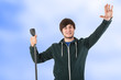 Young man at the microphone thanks the audience