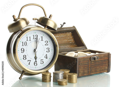 Photo: Alarm clock with coins in chest isolated on white Alarm clock with coins in chest isolated on white