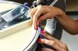 Foto: Industrial textile factory, woman at work, detail Industrial textile factory, woman at work, detail