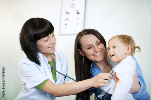 Photo: Doctor examining child Doctor examining child