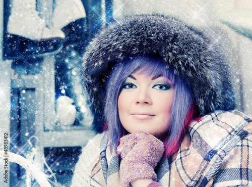 Photo: beautiful woman in winter fur hat. beautiful woman in winter fur hat.