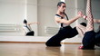 Professional dancers dancing in ballroom, dolly shot