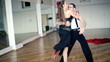 Professional dancers dancing in ballroom