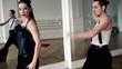Professional dancers dancing in ballroom, steadicam shot
