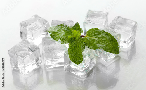 Photo: Ice with mint isolated on white Ice with mint isolated on white