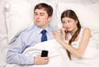 businessman and woman in bed