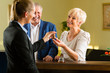 Reception - Guests check in a hotel