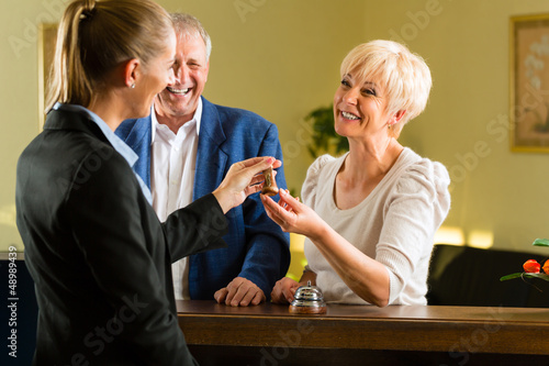 Photo: Reception - Guests check in a hotel Reception - Guests check in a hotel