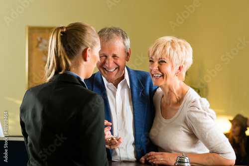 Photo: Reception - Guests check in a hotel Reception - Guests check in a hotel