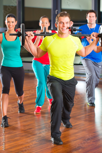 Photo: weight training in the gym with dumbbells weight training in the gym with dumbbells