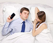 woman and businessman in bed