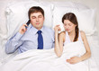 businessman and woman in bed