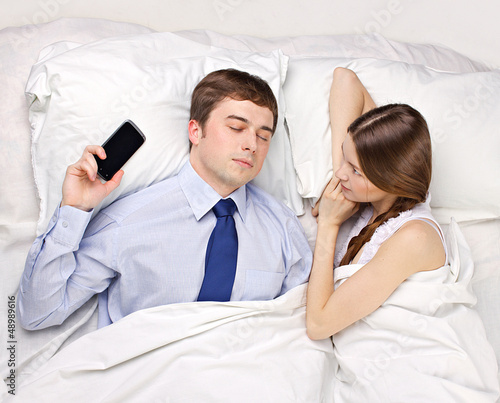 Photo: woman and businessman in bed woman and businessman in bed