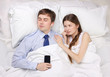 businessman and woman in bed