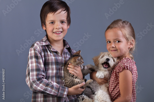 Photo: Beautiful kids with their lovely pets Beautiful kids with their lovely pets
