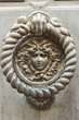 Doorknocker. Piacenza. Emilia-Romagna. Italy.