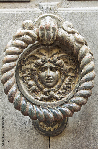 Photo: Doorknocker. Piacenza. Emilia-Romagna. Italy. Doorknocker. Piacenza. Emilia-Romagna. Italy.