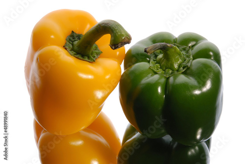 Photo: green and yellow sweet pepper on a white background green and yellow sweet pepper on a white background