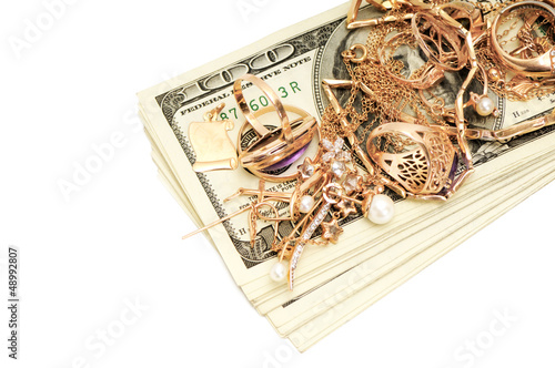Photo: Gold ornaments and dollar isolated on white background Gold ornaments and dollar isolated on white background