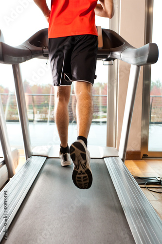 Photo: Man training on treadmills Man training on treadmills