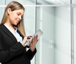 Photo: Businesswoman using electronic tab Businesswoman using electronic tab