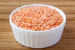 Red lentils in white ceramic cup