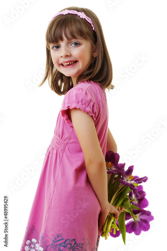 Photo: happy little girl with bunch of flowers - mothers day happy little girl with bunch of flowers - mothers day