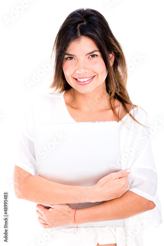 Photo: Woman holding a laptop Woman holding a laptop