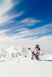 Beautiful skier on the top of mountain