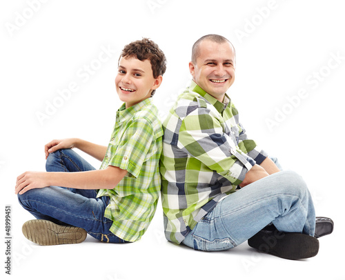 Photo: Father and son back to back Father and son back to back