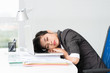 Tired Asian businesswoman