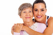 happy senior mother and adult daughter closeup portrait on white