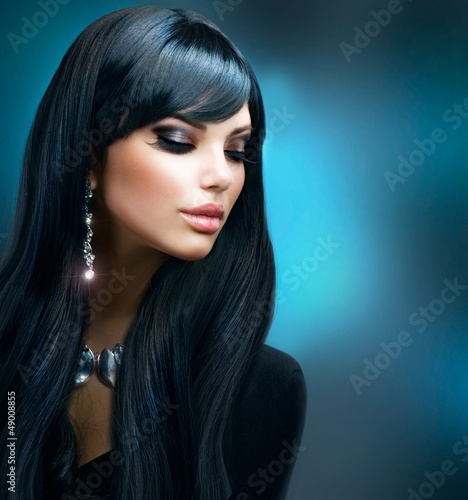 Photo: Brunette Girl. Healthy Long Hair and Holiday Makeup Brunette Girl. Healthy Long Hair and Holiday Makeup