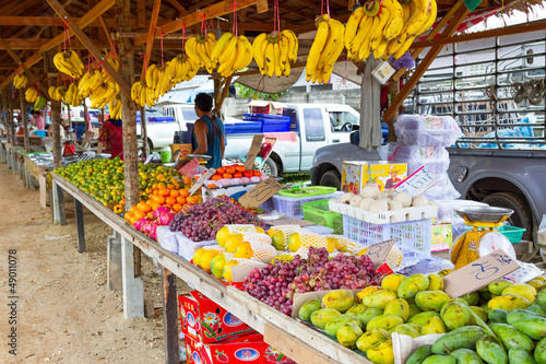 Photo: Fruits stand on the local market in Khao Lak, Thailand Fruits stand on the local market in Khao Lak, Thailand