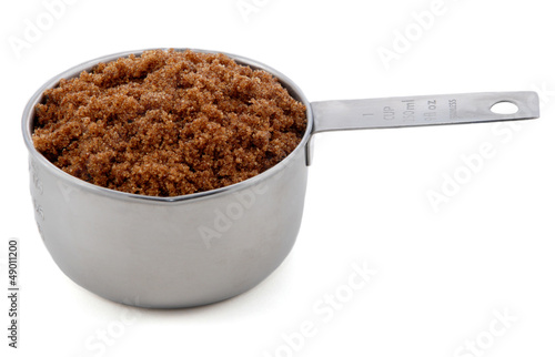 Photo: Dark brown soft / muscovado sugar presented in a cup measure Dark brown soft / muscovado sugar presented in a cup measure
