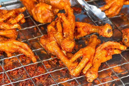 Photo: Deep fried chicken feet on the local market in Thailand Deep fried chicken feet on the local market in Thailand