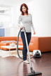 Attractive Female with Vacuum Cleaner