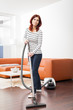 Attractive Female with Vacuum Cleaner