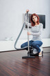 Attractive Female with Vacuum Cleaner