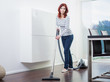 Attractive Female with Vacuum Cleaner